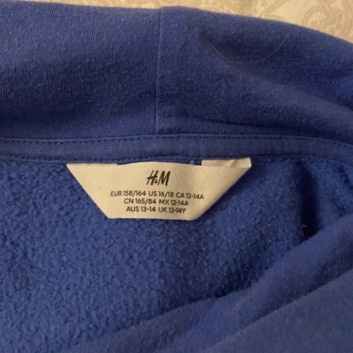 Blå hoodie från H&M med huva - 1