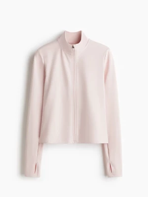 Ljusrosa träningskofta  - Sportig ljusrosa tröja med dragkedja framtill och hög krage. Tillverkad i ett mjukt, stretchigt material som passar perfekt till träning eller chill. Långärmad modell med tumhål vid ärmsluten för extra komfort. Nypris 350kr