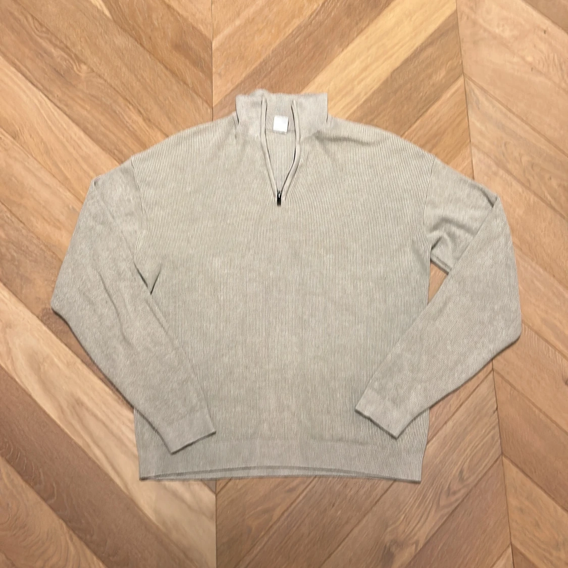 Stickad halv zip beige