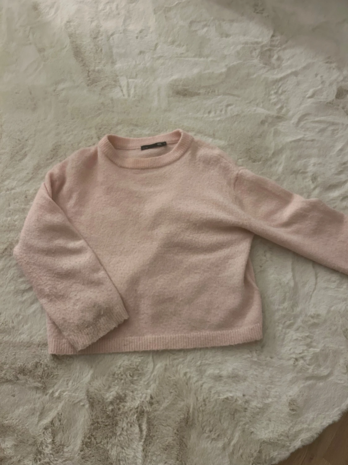 Ljusrosa stickad tröja