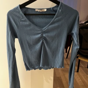 Blå topp  - Storlek S, använd Max 1 gång 