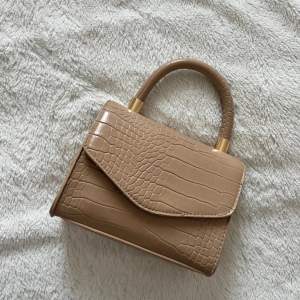 Can be worn as handbag or crossbody. Perfect condition. Gold details.