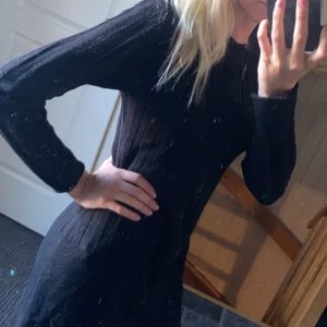 Klänning - En stickad klänning i storlek M.