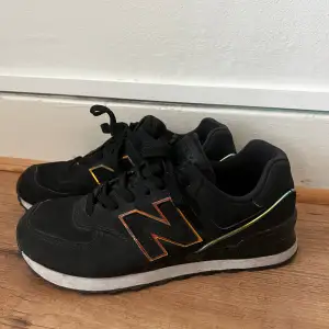 Black new balance trainers size 38. They have a really cool holographic effect on the details! They’re really cute trainers they’re just a bit small on me so I only wore them a few times 😭