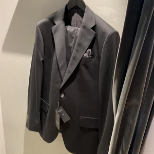 Kostym sand Copenhagen  - Kostym ny storlek 52 Svart 