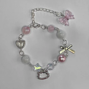 Rosa Hello Kitty Armband  - Längd: 19 -24 cm. Längd kan justeras efter förfrågan 🎀🎀🎀