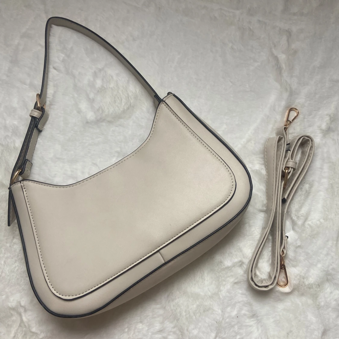 Beige handvĂ€skađ