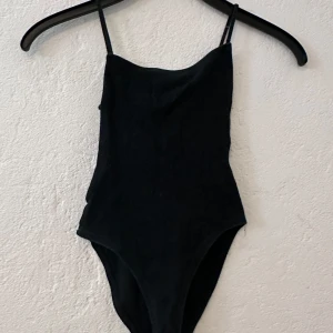 Bodysuit  - used a few times, size xs/xxs, the back is open 
