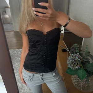 Svart korsett - Snygg korsett-topp perfekt till fest, liten i storleken 