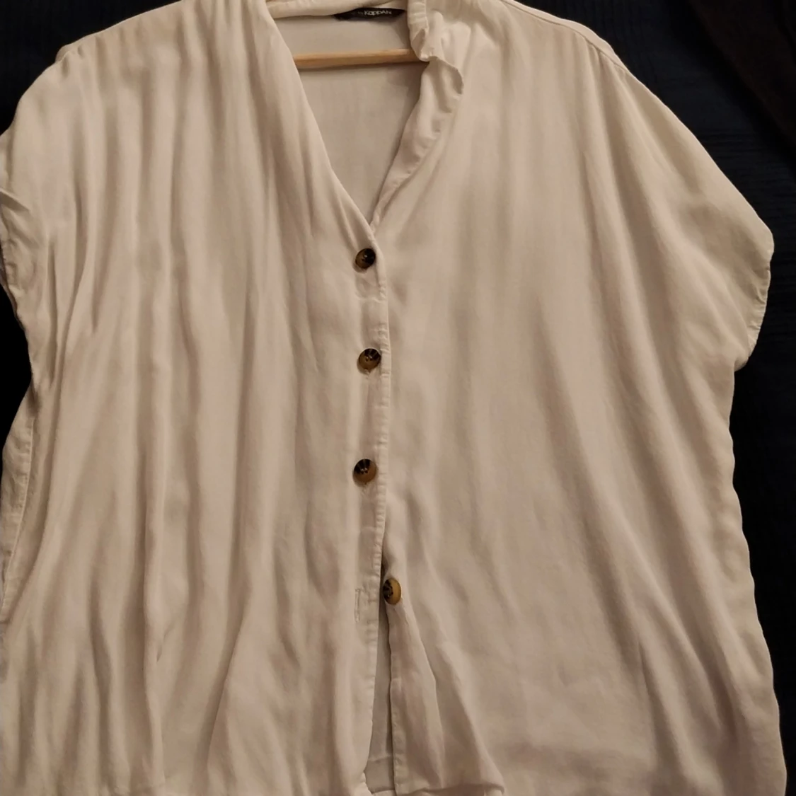 White shortarmed cardigan