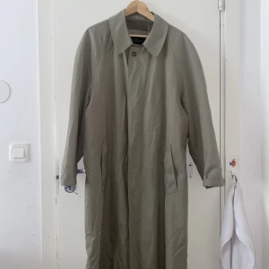 Trenchcoat  - 9/10 used for filming productions. Actually a very nice piece. Classy and would go well witg anything