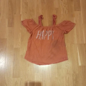 Brunrosa happy tröja  - Enkla fläkar, men inget slitet 