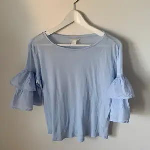 Ljusblå tröja från H&M, strl: XS