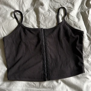 Svart topp - Använd en gång.