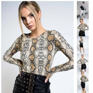 Snake tröja  - Jättefin ormmönstrad tröja, nästan aldrig använd.  Materialet är lite stretchigt. Tröjan säljs inte längre i butiken då den utgått i sortimentet. 