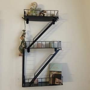 Uncommon bookshelf that looks like a fire escape. All the parts are able to remove or switch places super cute and pretty in your room. 