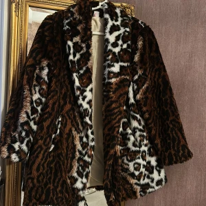 Kappa  - Oanvänd kappa i M/L 