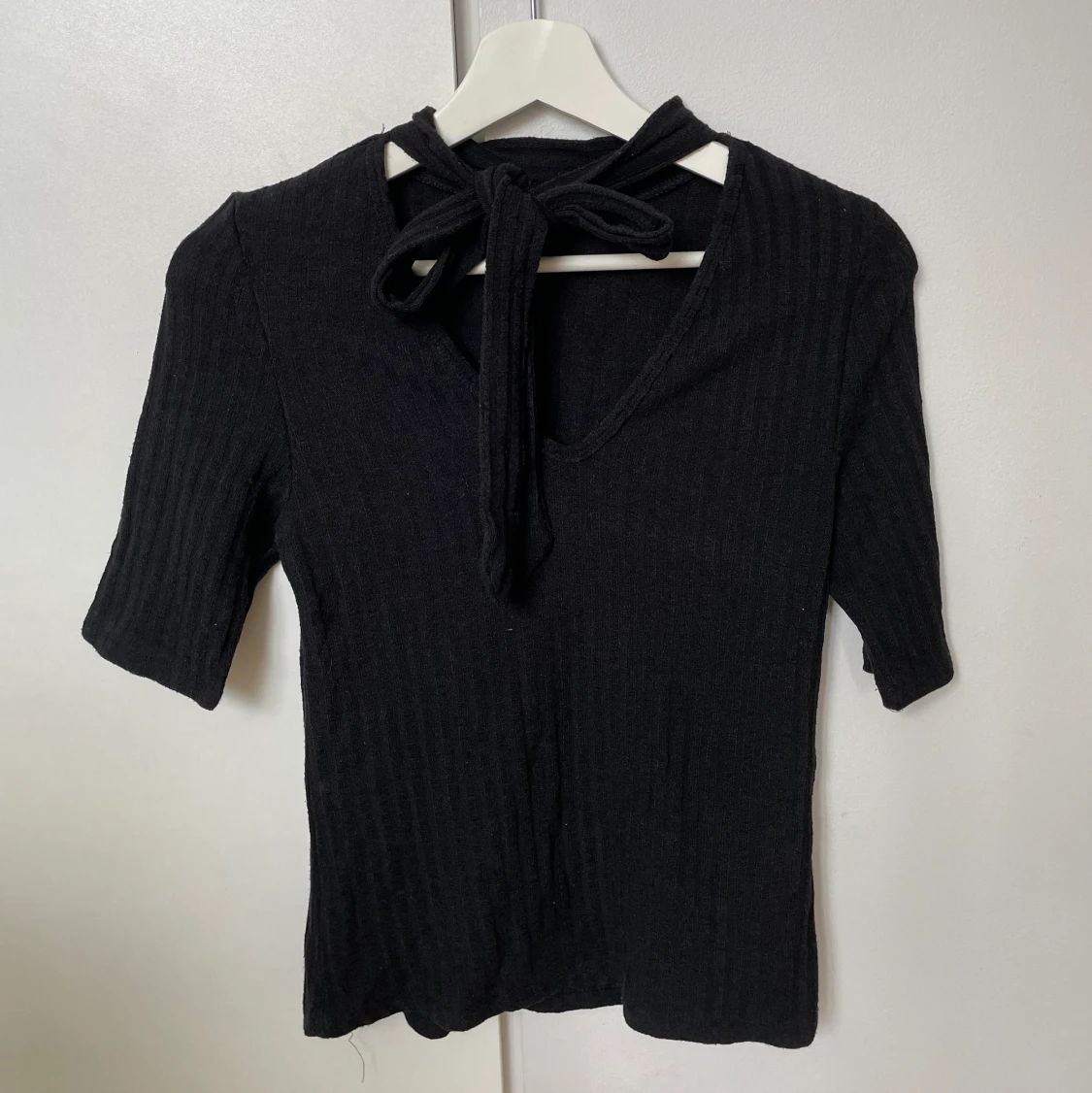 Topp med knytning i halsen