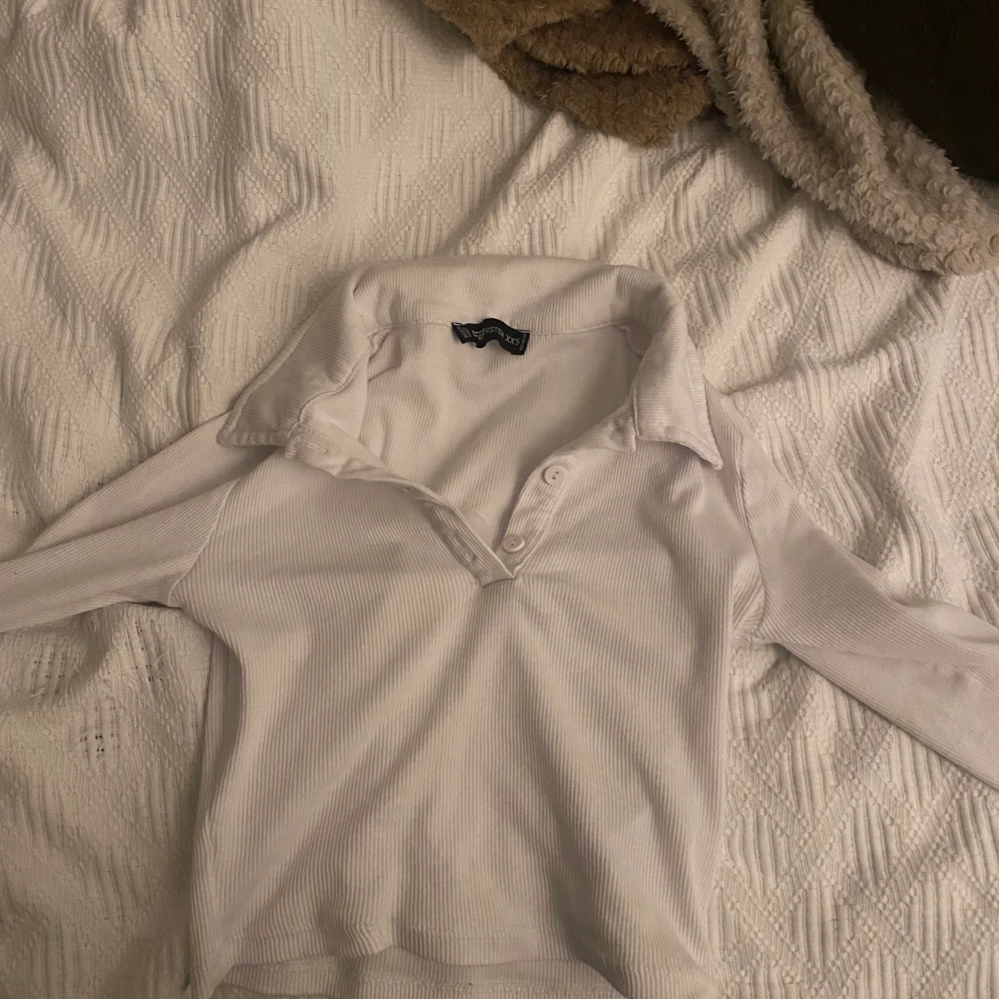 Långärmad med knappar