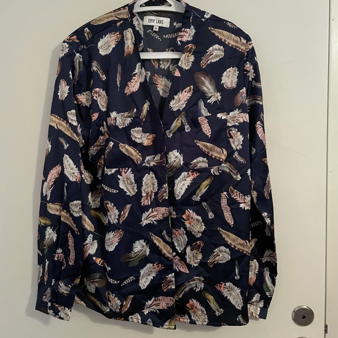 Blus fjädrar Dry lake medium - 90