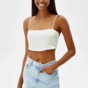 Oanvänd Crop top med smala band storlek Xs