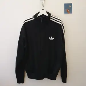 Adidas jacket: black color