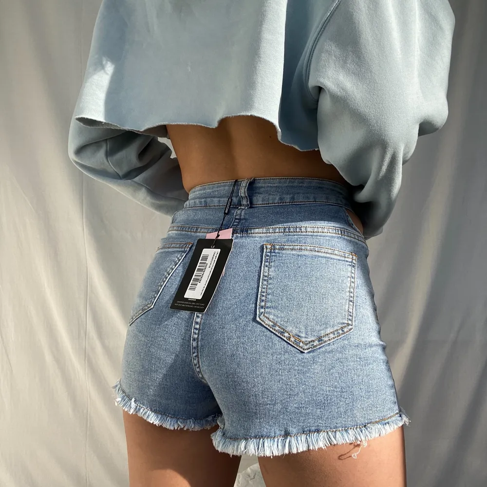 HEY I’m selling these new jeans shorts I ordered from pretty little thing. They are a size 10/ 38 and have cut outs in the waist area. They’re super soft and easy to style. SALE IS ONLY UNTIL 10. JUNE!!. Shorts.