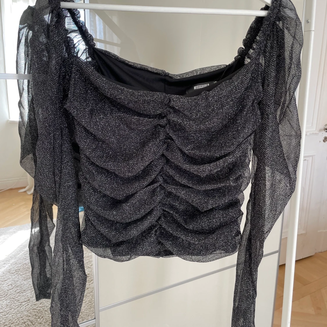 Glittrig långärmad topp