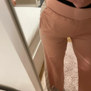 Puma pants S - Puma pants with side strap detail. I never used them because they are small for me but was lazy to return them.