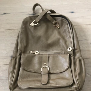 Faux backpack/bag - It’s convertible so that you can wear it as a backpack or a bag. It’s true color is more like cacao with yellowish undertone. 