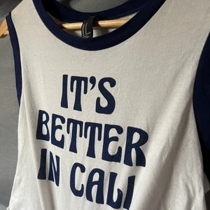 White tee  - Its better in Cali tee from Forever 21. In size M. 