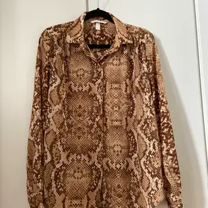 H&M blouse in size XS. Barely used. 