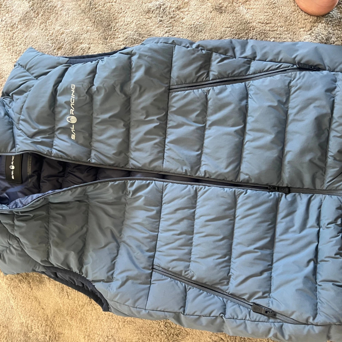 Blå dunväst från Sail Racing XS