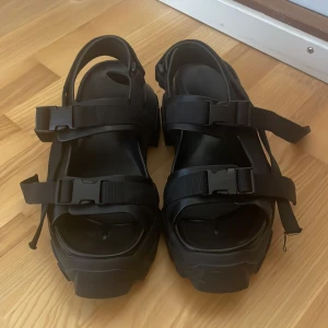 Rick Owens tractor platform sandals - Black Rick Owens tractor platform sandals. Size 37, purchased new and worn only a few times. Fully adjustable fit. In good condition with only very minor scuffing on the back heel (shown in picture). Authentic, purchased directly from RO retailer online in US 5-7 years ago (I don’t have the receipt anymore). Made in Italy