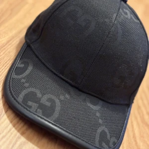 GG keps svart  - Storlek one size 