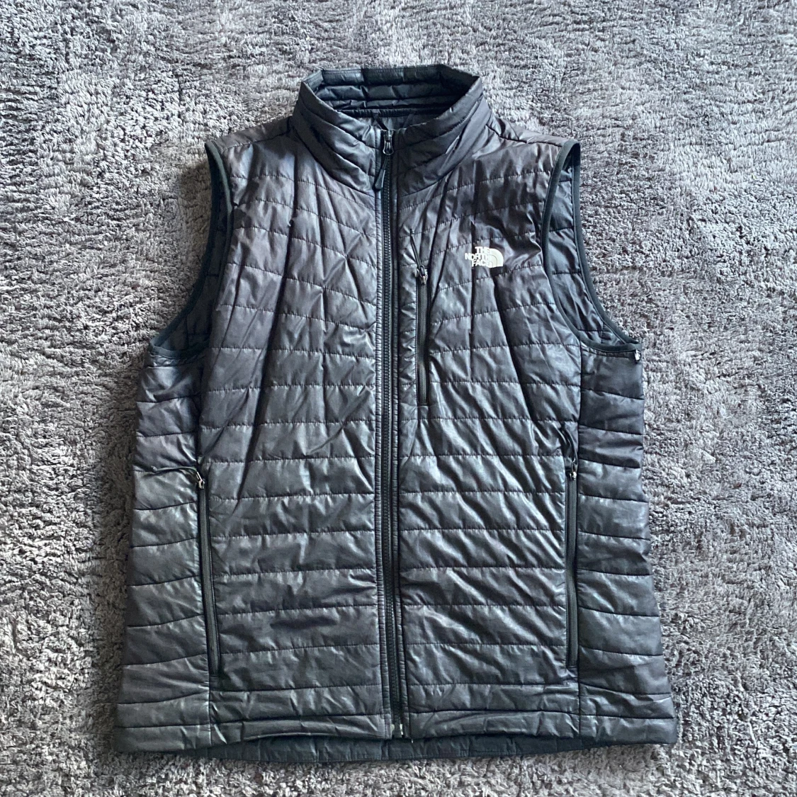 Svart dunväst från The North Face M
