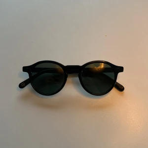 Svarta runda solglasögon - Moscot Miltzen fold 