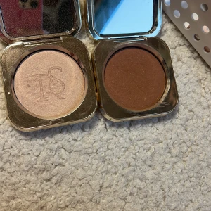 Highlighter & bronzer Rebecca Stella  - Highlighter & bronzer från Rebecca Stella, framsidan av förpackningen är lite fläckig annars väldigt bra skick 