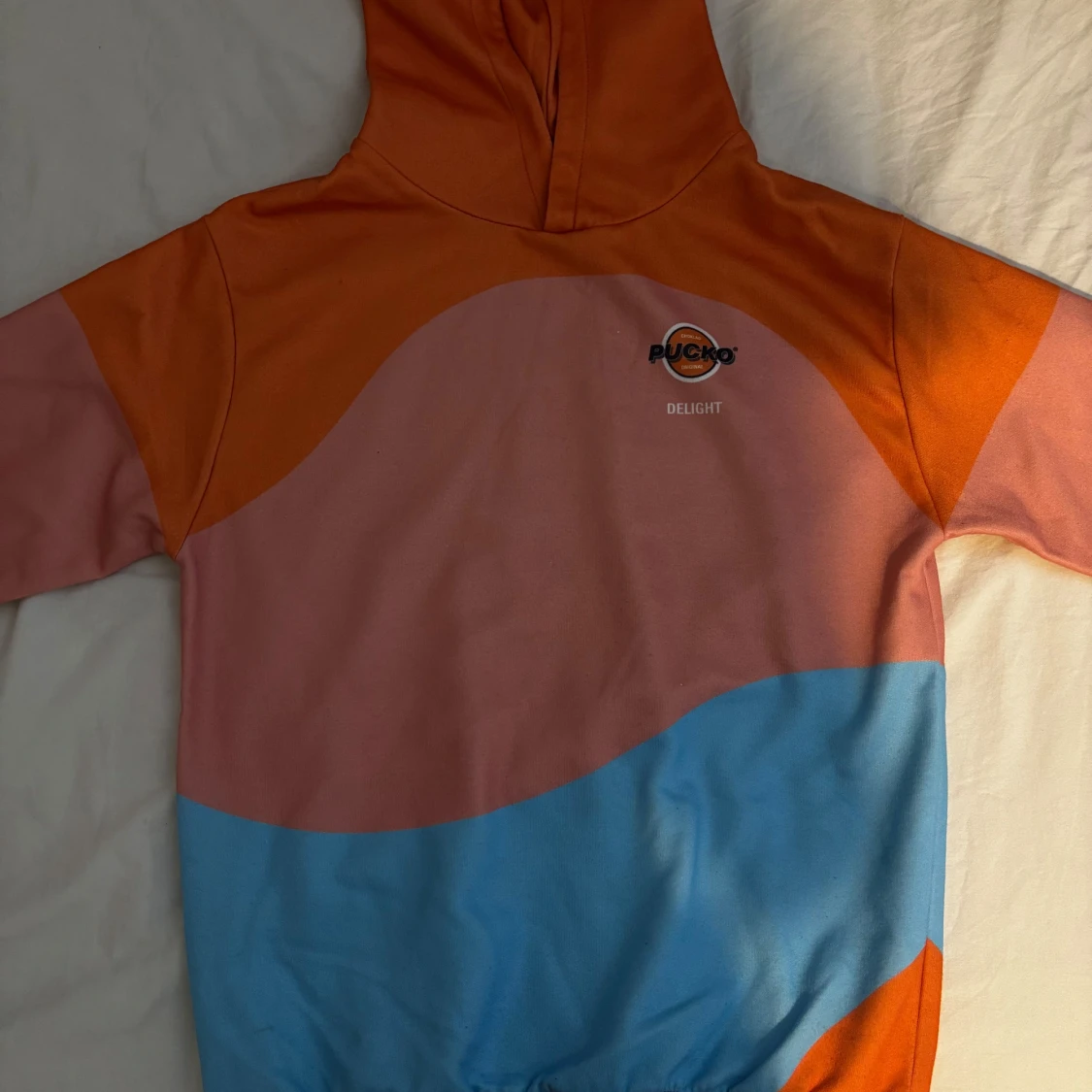 PUCKO hoodie i orange, rosa och blå