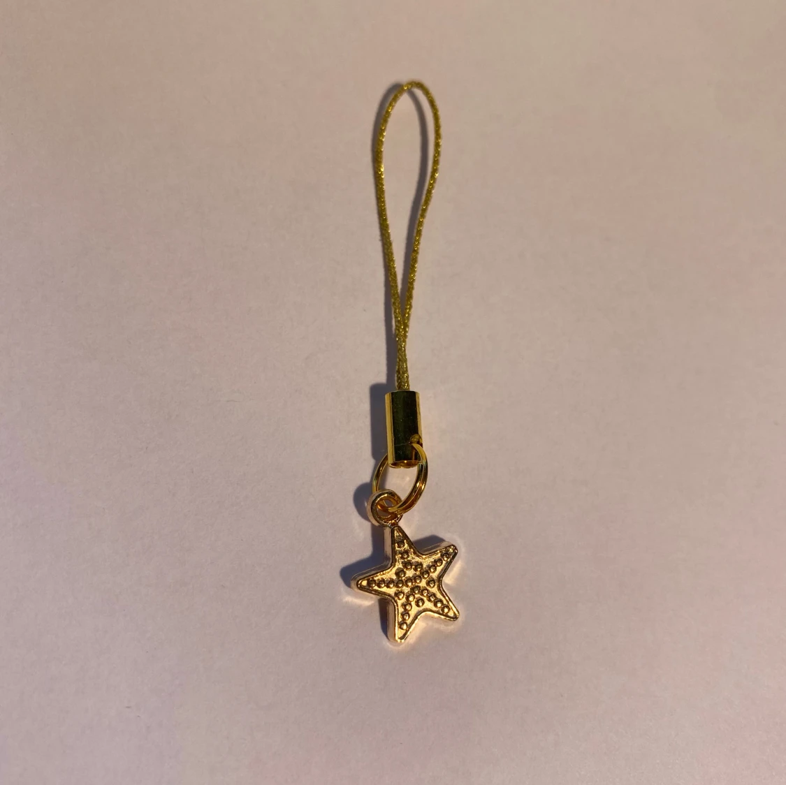 Hänge med en sjöstjärna i guld - 1