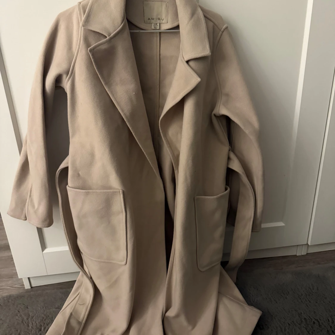 Beige kappa från Amisu