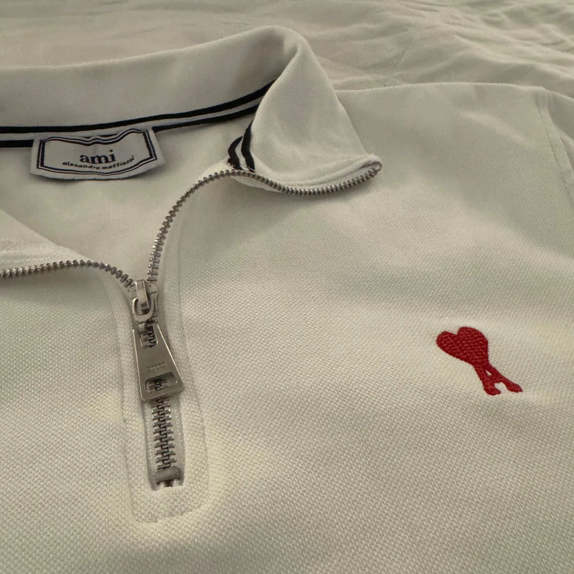 Vit half zip pikétröja från Ami