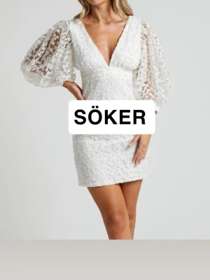 Vit kort klänning med puffärmar - Söker denna vita klänningen 