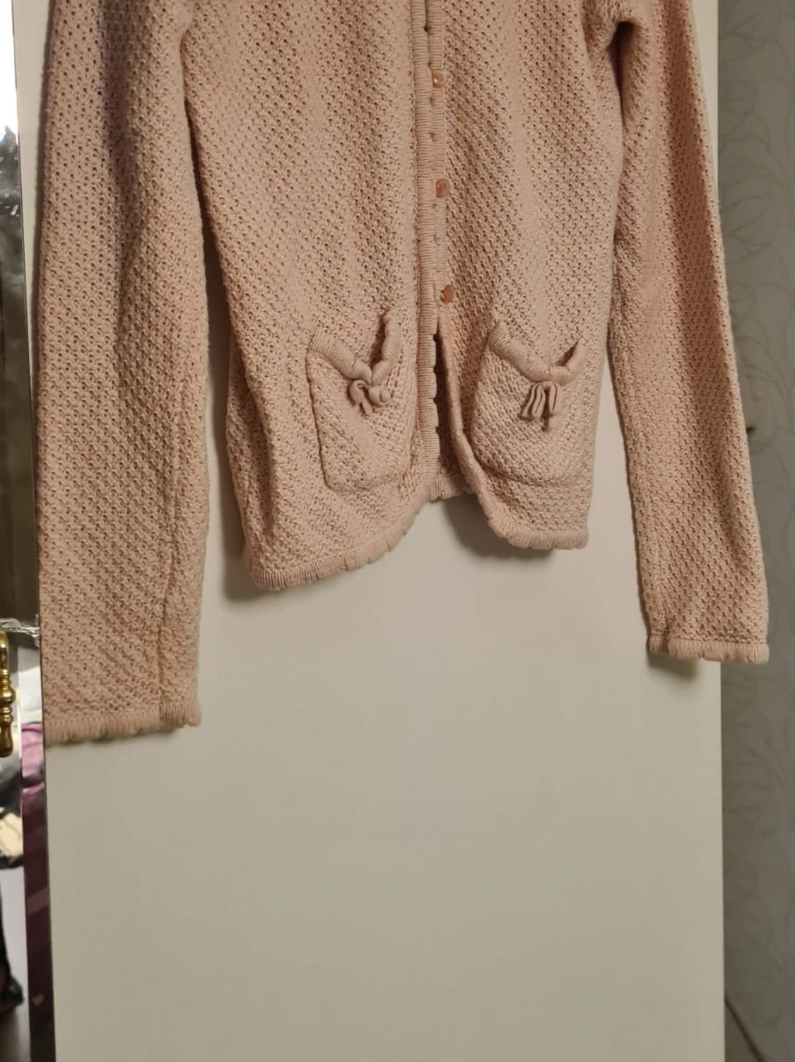 Ljusrosa stickad kofta med fickor
