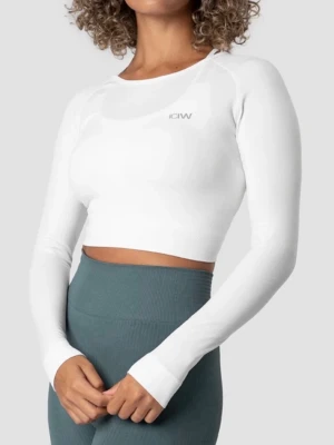 Vit croppad långärmad topp ICANIWILL - Vit croppad topp med lång ärm från ICANIWILL. Tillverkad i stretchigt syntetmaterial som sitter tight och ger en sportig look. Rund halsringning och diskret logga framtill. Perfekt för träning eller en aktiv vardag.
