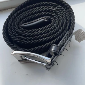 Grisch bälte  - Den är bra skick helt ny är använd en gång.