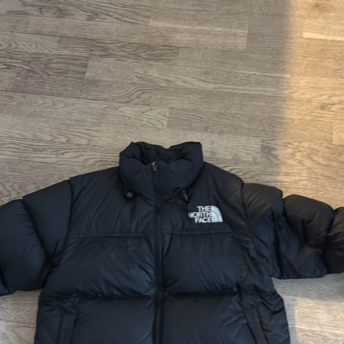 Svart dunjacka från The North Face