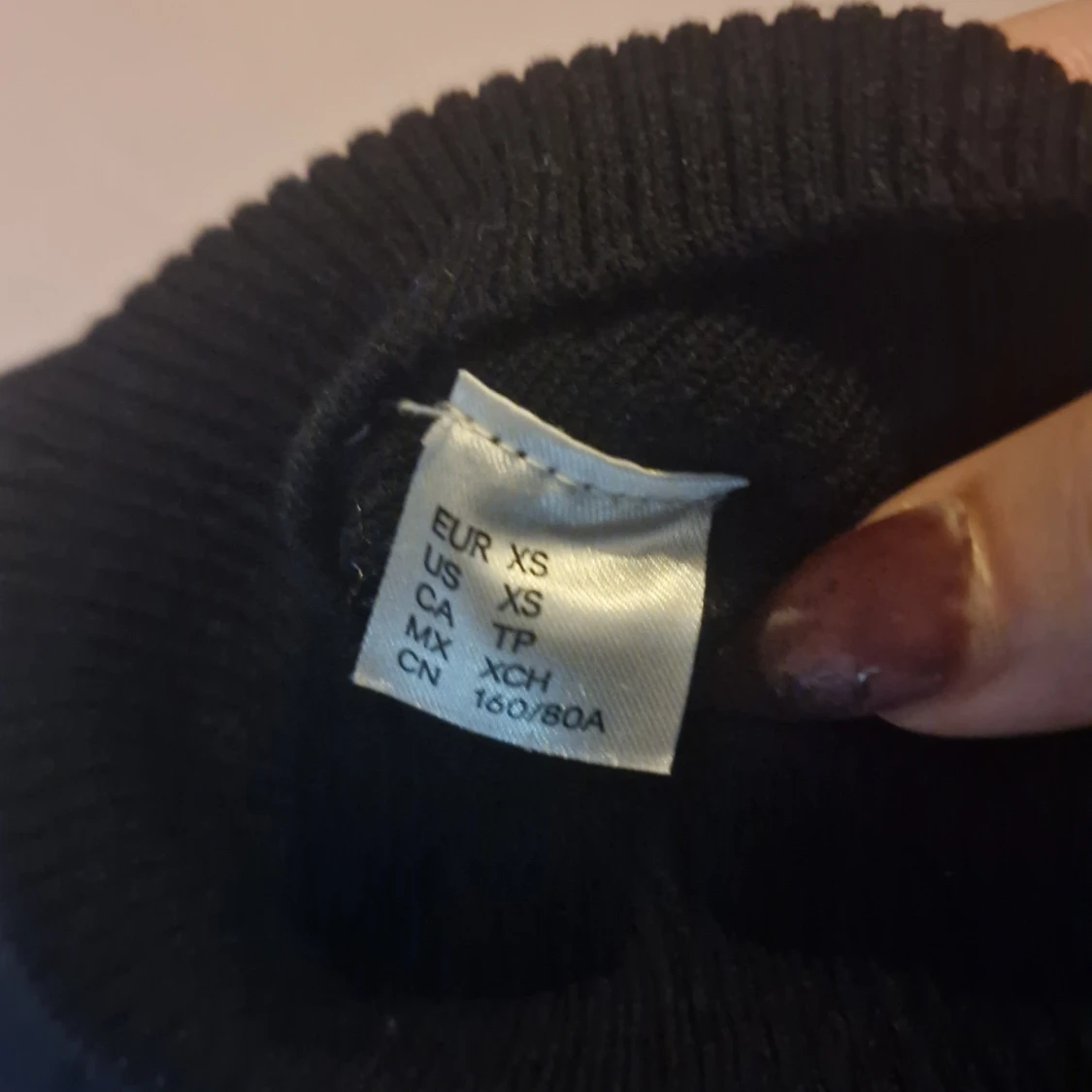 Svart polotröja i storlek XS - 90