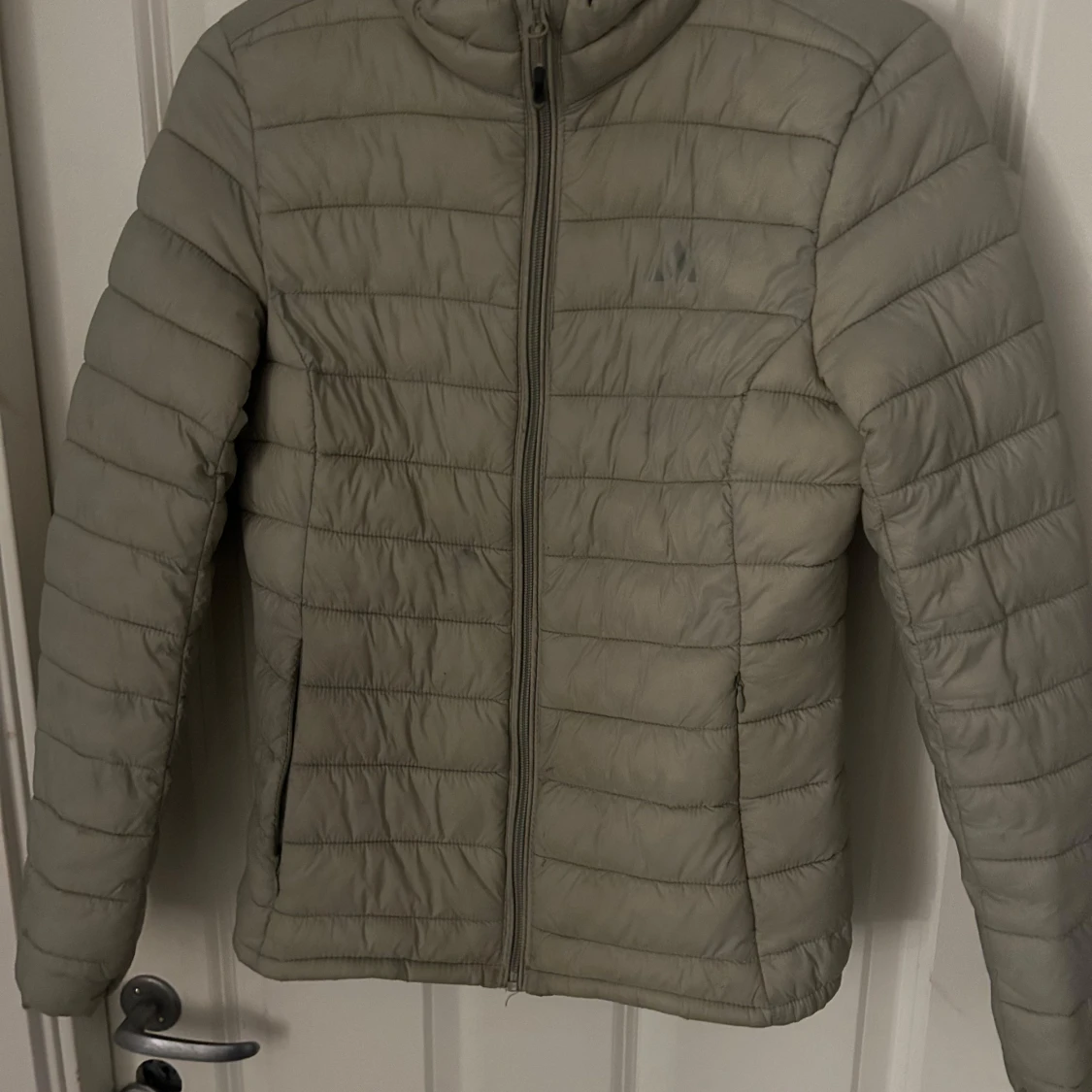 Beige pufferjacka från Whistler