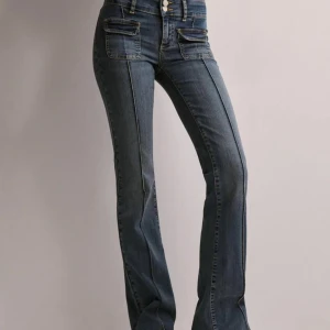 Blå bootcut jeans nelly - Skit snygga nelly jeans, knappt använda då dom tyvärr inte passar